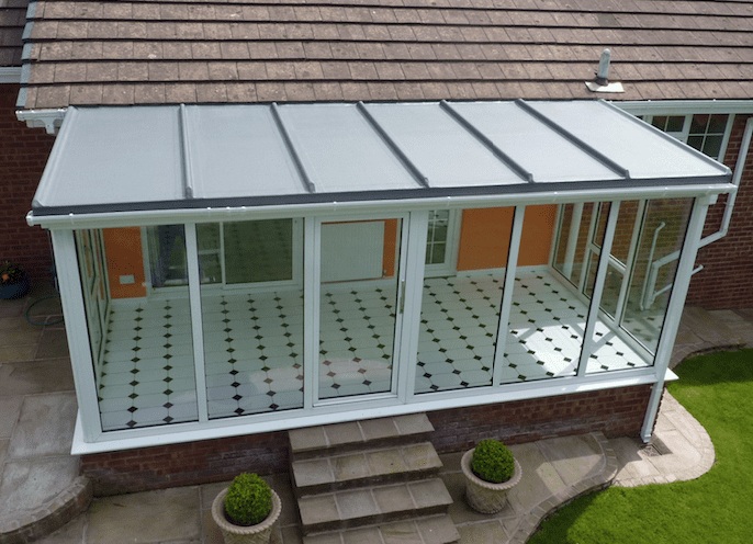 UPVC style orangery room with a new flat roof